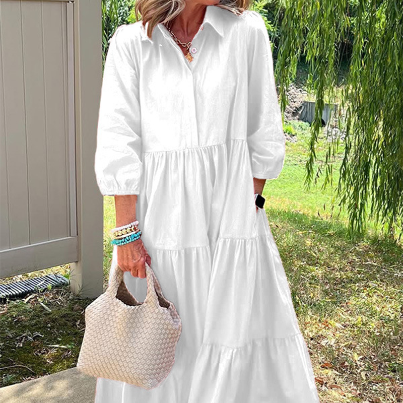 Női bő szabású, bokáig érő ruha hajtókával